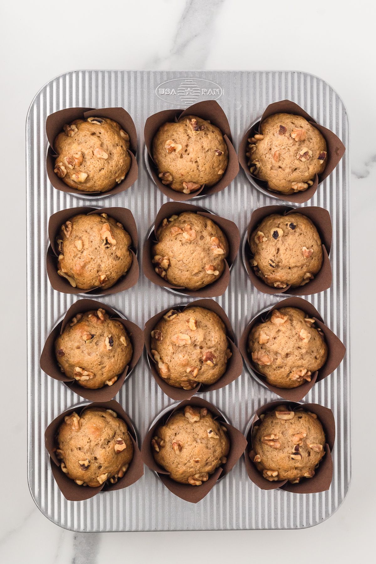 Baked banana bread muffins in the muffin tin