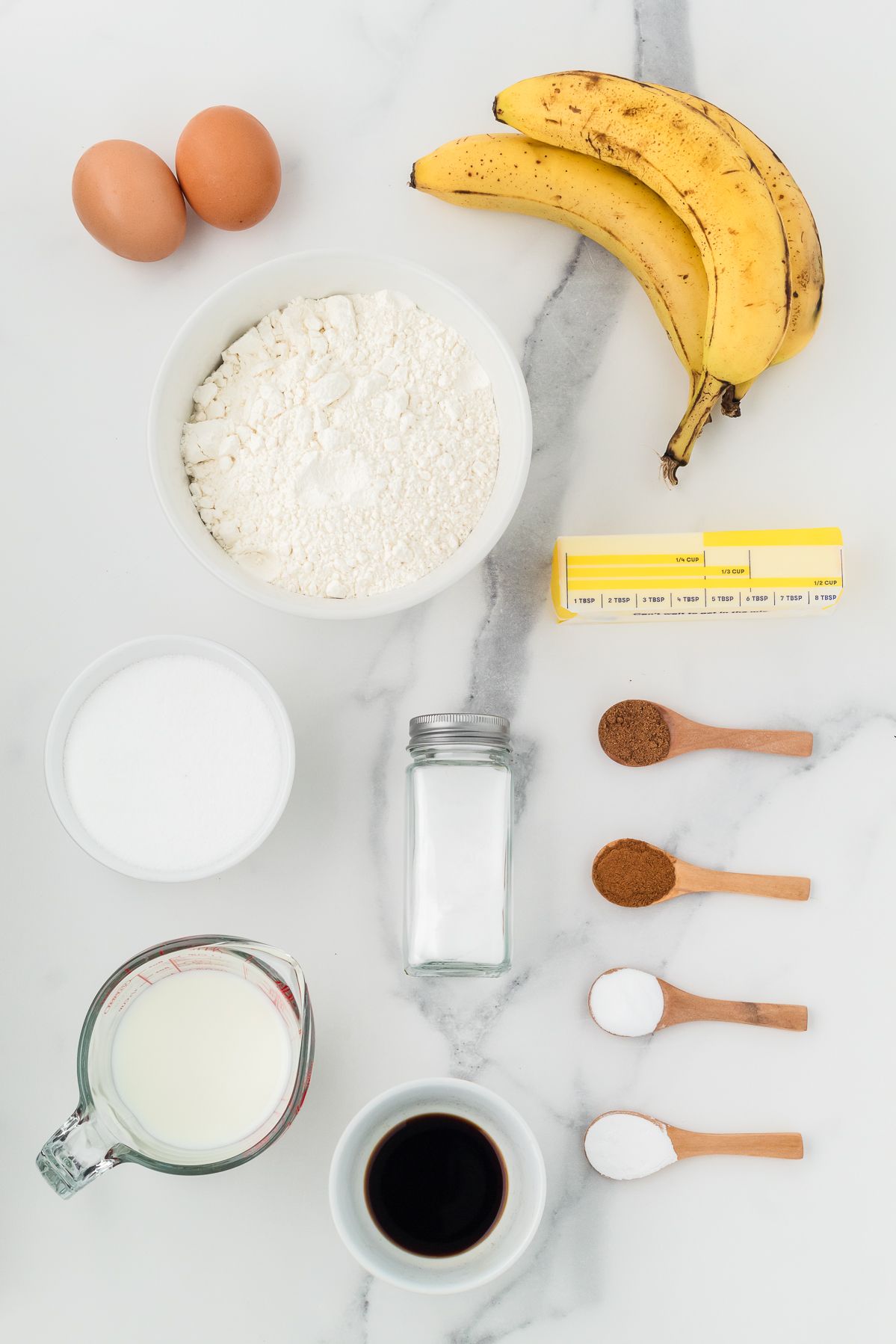Ingredients for banana muffins: ripe bananas, flour, sugar, butter, milk, eggs and spices