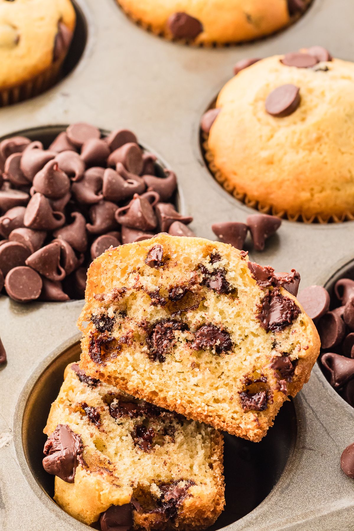 Chocolate chip muffin split open to show the tender inside