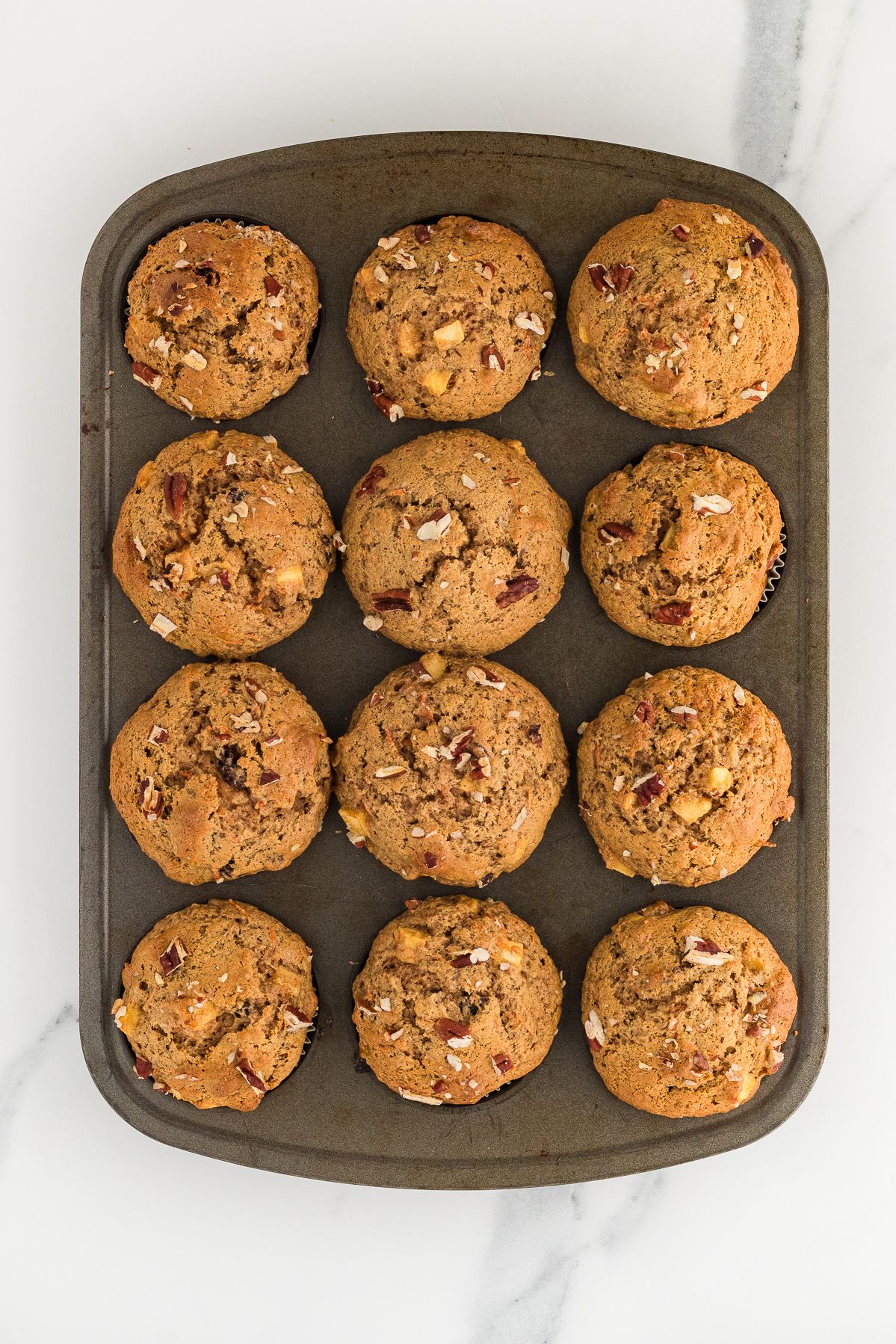 Baked gluten free morning glory muffins in the pan