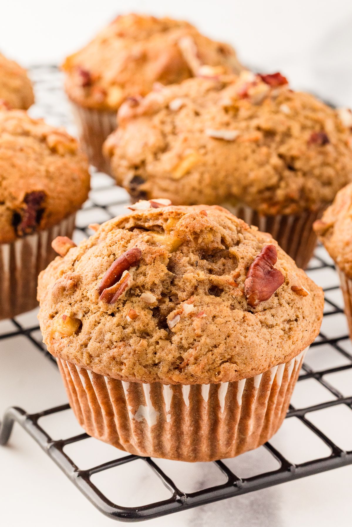 Gluten free morning glory muffins on a cooling rack