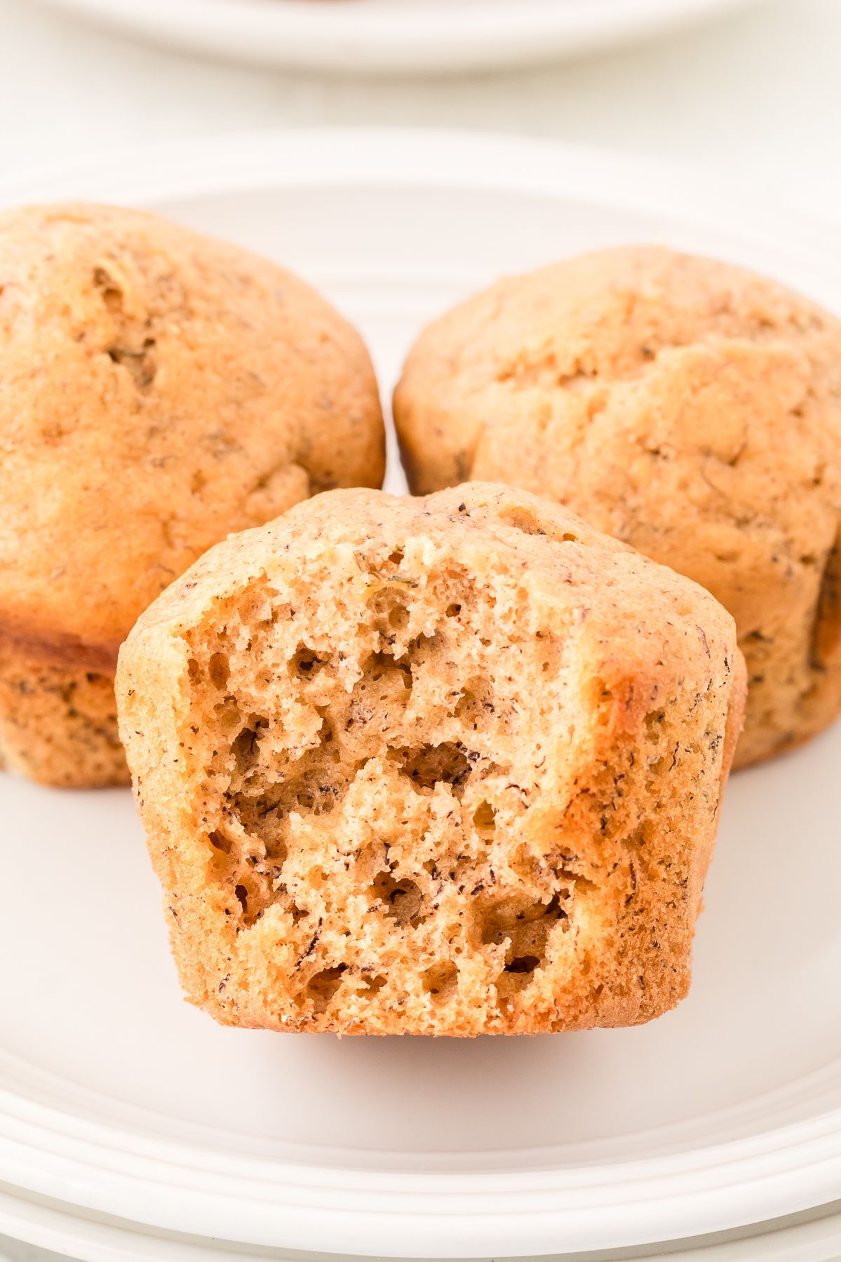 Healthy banana muffin with a bite taken out showing the moist crumb