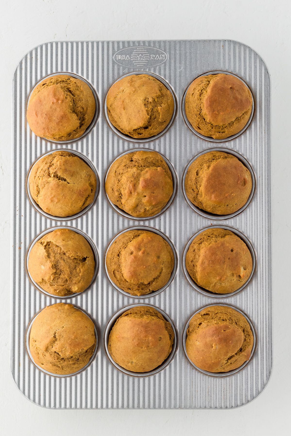 Baked healthy pumpkin muffins in the muffin tin