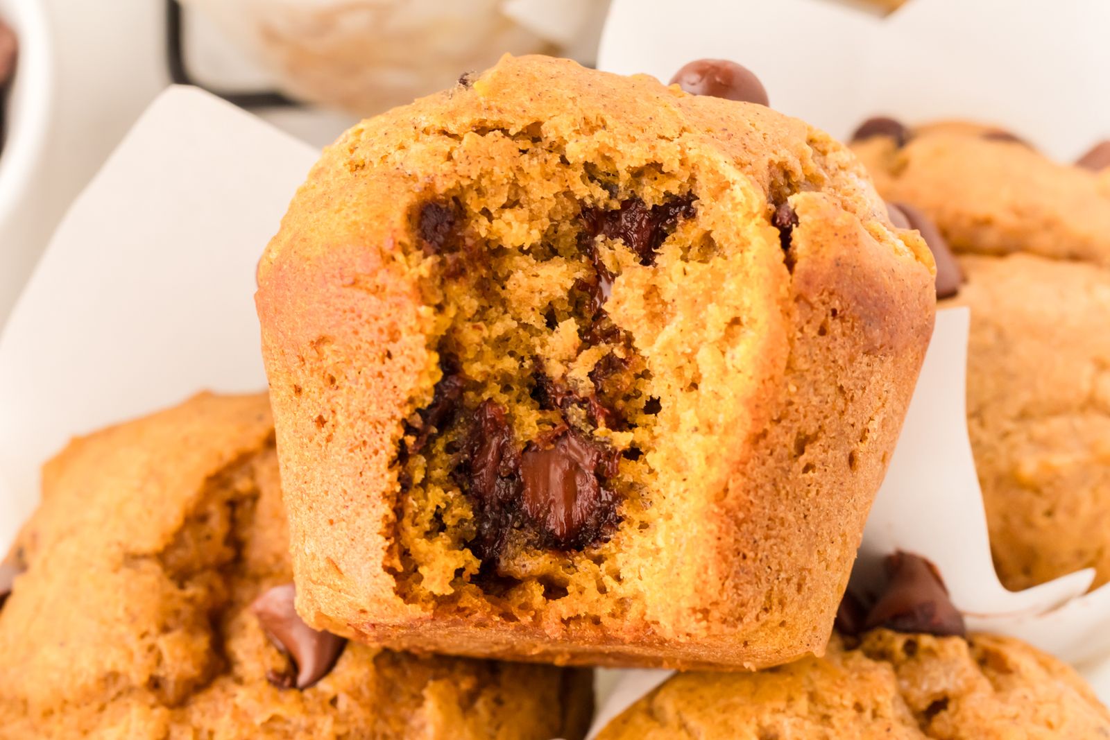 Pumpkin chocolate chip muffin with a bite taken out