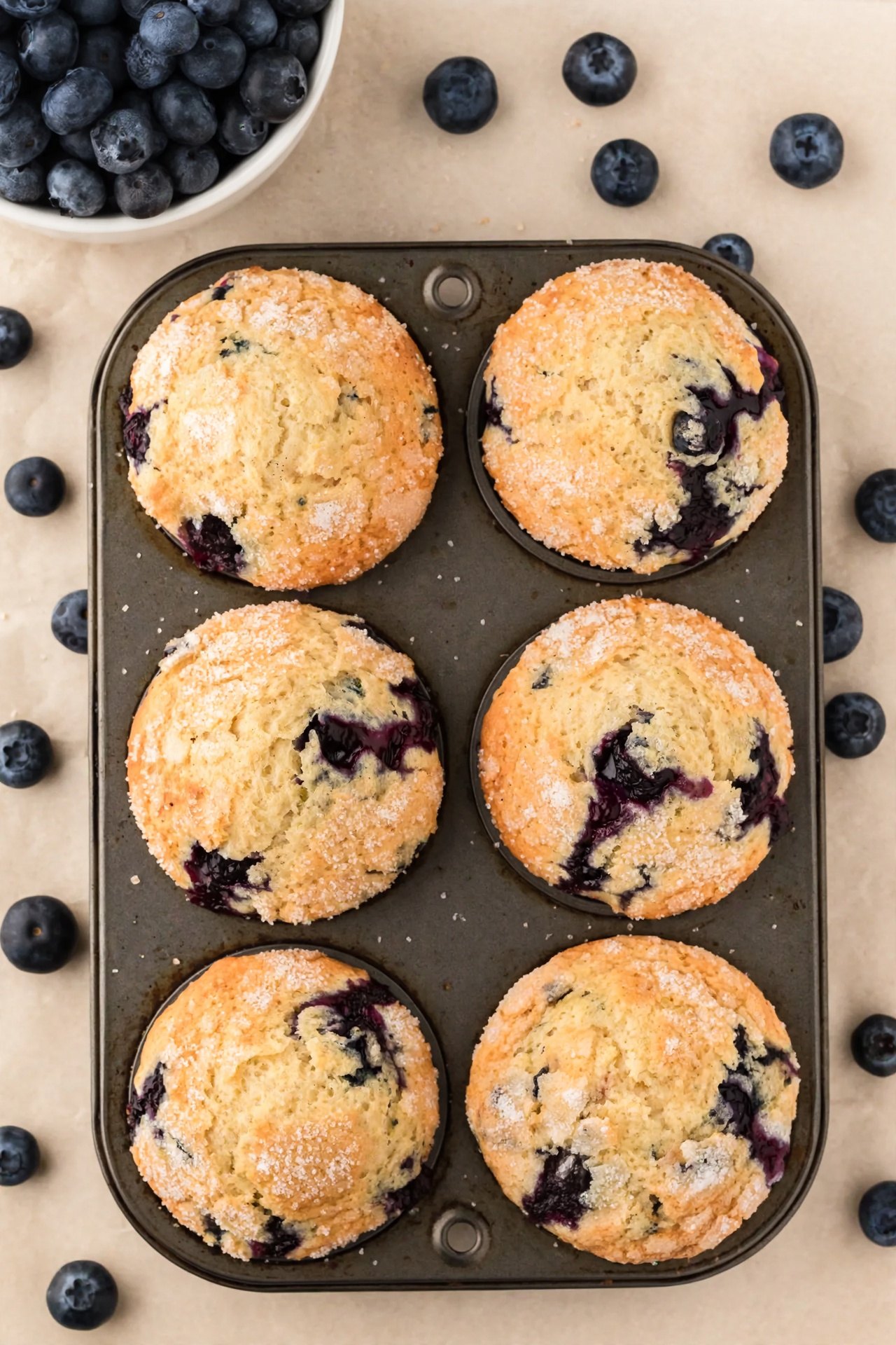 Overhead view of gluten free Jordan Marsh blueberry muffins with sugar tops